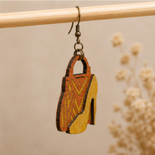 Cargar imagen en el visor de la galería, Side detail of Bag & Heels 3D wooden earrings showing the layered wood construction and bronze-tone hook.
