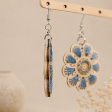 Cargar imagen en el visor de la galería, Side view of Blue Blossom embroidered wooden earrings showing the wood edge, front embroidery, and felt backing.
