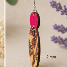 Cargar imagen en el visor de la galería, Side profile of hand-painted butterfly wooden earrings showing the 2 mm American linden wood thickness.