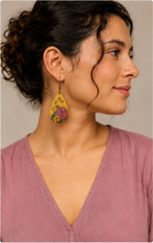 Cargar imagen en el visor de la galería, Model wearing Hooked on Crochet wooden earrings with a soft mauve top and hair pulled back.