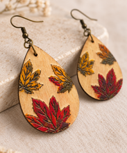 Cargar imagen en el visor de la galería, Close-up of Leaf Whispers hand-painted laser-engraved wooden earrings showing the dimensional leaf effect