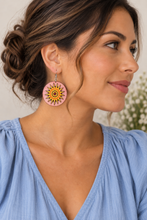 Cargar imagen en el visor de la galería, Model wearing Sunheart lightweight layered wooden sun earring with silver-tone hook and soft sky-blue top