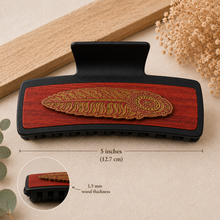 Cargar imagen en el visor de la galería, Large 5-inch black hair clip with hand-painted American linden wood base and layered feather detail, showing 1.5 mm wood thickness.