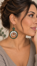 Cargar imagen en el visor de la galería, Model wearing Lunar Dance lightweight articulated wooden earrings with a soft mushroom warm greige top
