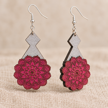 Cargar imagen en el visor de la galería, Close detail and angled view of Mystic Mandala Bloom layered wooden earrings highlighting the engraved magenta mandalas, hand-painted gray bases, visible wood edges and silver-tone hooks.
