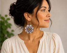 Cargar imagen en el visor de la galería, Model wearing the reversible mandala wooden earrings with an ivory top, showing realistic scale.
